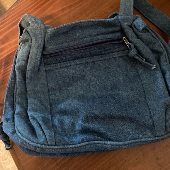A blue Jean pocket book back pocketbook opens all the way to carry a book in - Picture 2 of 4